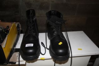 A pair of Warrior steel toe cap work boots size 13