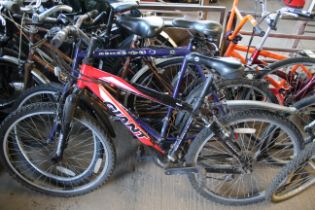 A mens Giant Rock mountain bike with front suspens