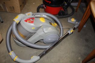 A Dyson DC02 vacuum cleaner