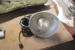 A metal hanging industrial style light fitting, so