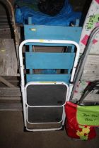 A small set of folding steps and a blue painted wo