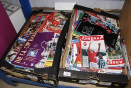 Two boxes of various football programmes