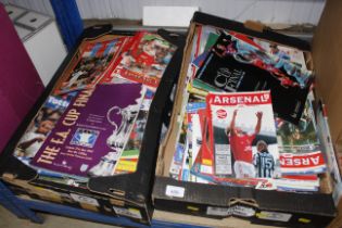 Two boxes of various football programmes