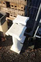 Two white plant pot stands in the form of Roman co