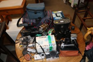 A collection of various cameras; accessories and b