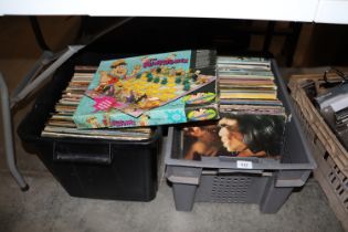 Two boxes of records and a Flint Stone chess set