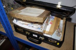 A briefcase and contents of various stamps