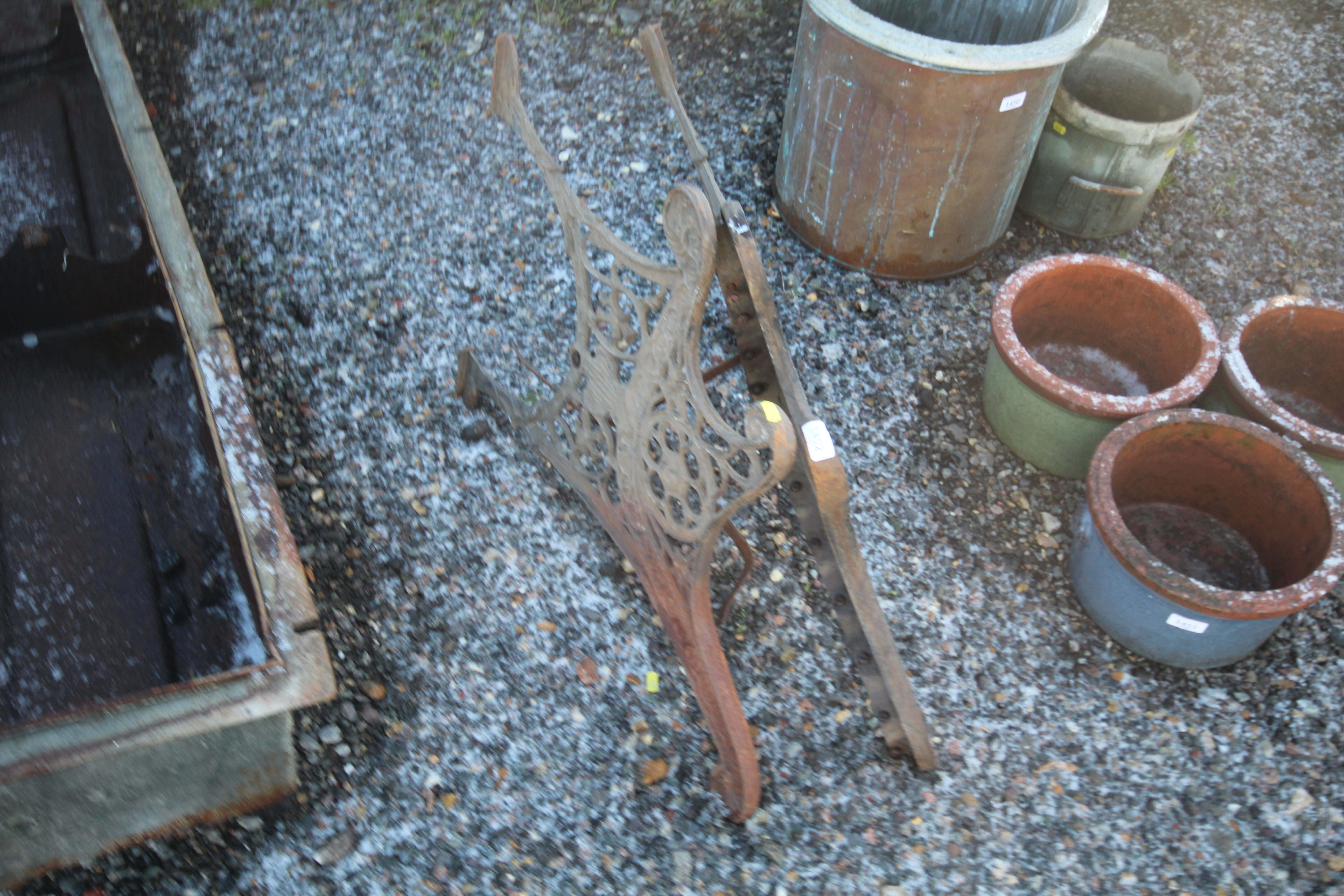 A pair of cast iron bench ends