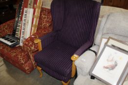 A wooden framed wing back armchair