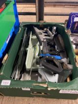 A box containing mitre saw and various attachments etc