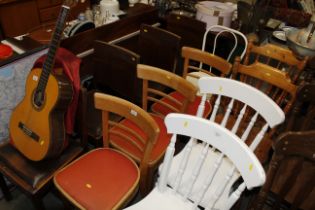 A metal framed chair and three retro style kitchen