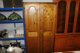 A Ducal pine two door wardrobe