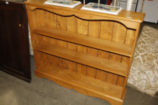 A pine open fronted bookcase