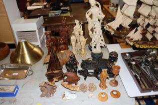 A collection of resin figures; carved wooden ornam