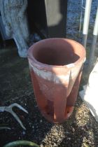 A terracotta chimney pot