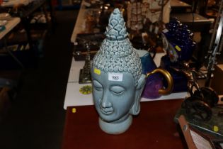 A blue glazed Buddha's head