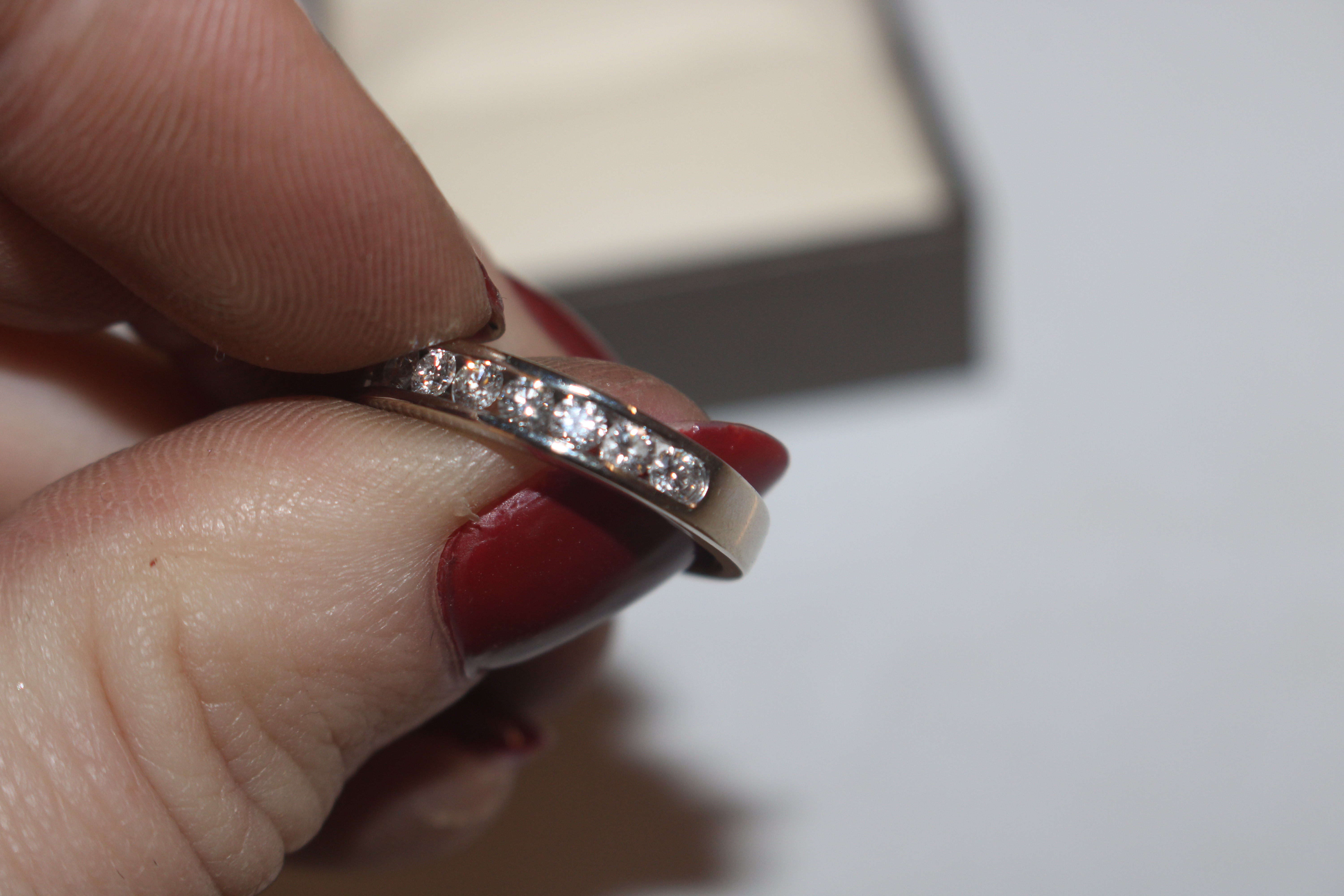 An 18ct white gold (marked rubbed) half eternity ring set with channel of ten diamonds totalling - Image 4 of 10