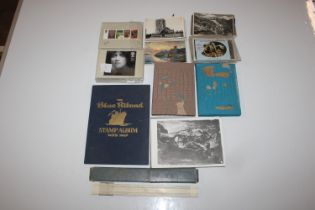 A box containing stamps; postcards and ephemera