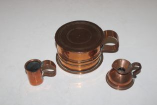 An Arts and Crafts style copper pot and cover with