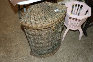 A wicker corner basket with applied carved wood de