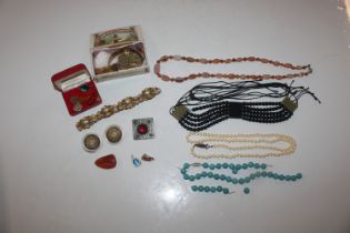 A basket and contents of various costume jewellery