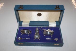 A cased silver three piece cruet set, Birmingham 1