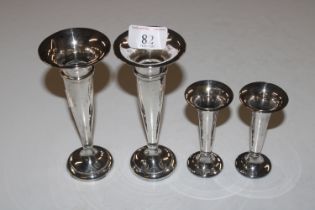 Two pairs of silver spill vases with weighted base
