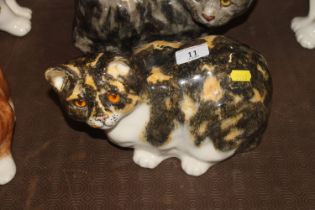 A Winstanley Pottery model of a cat with glass eye