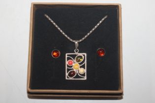 A Sterling silver and amber pendant and stud ear-r