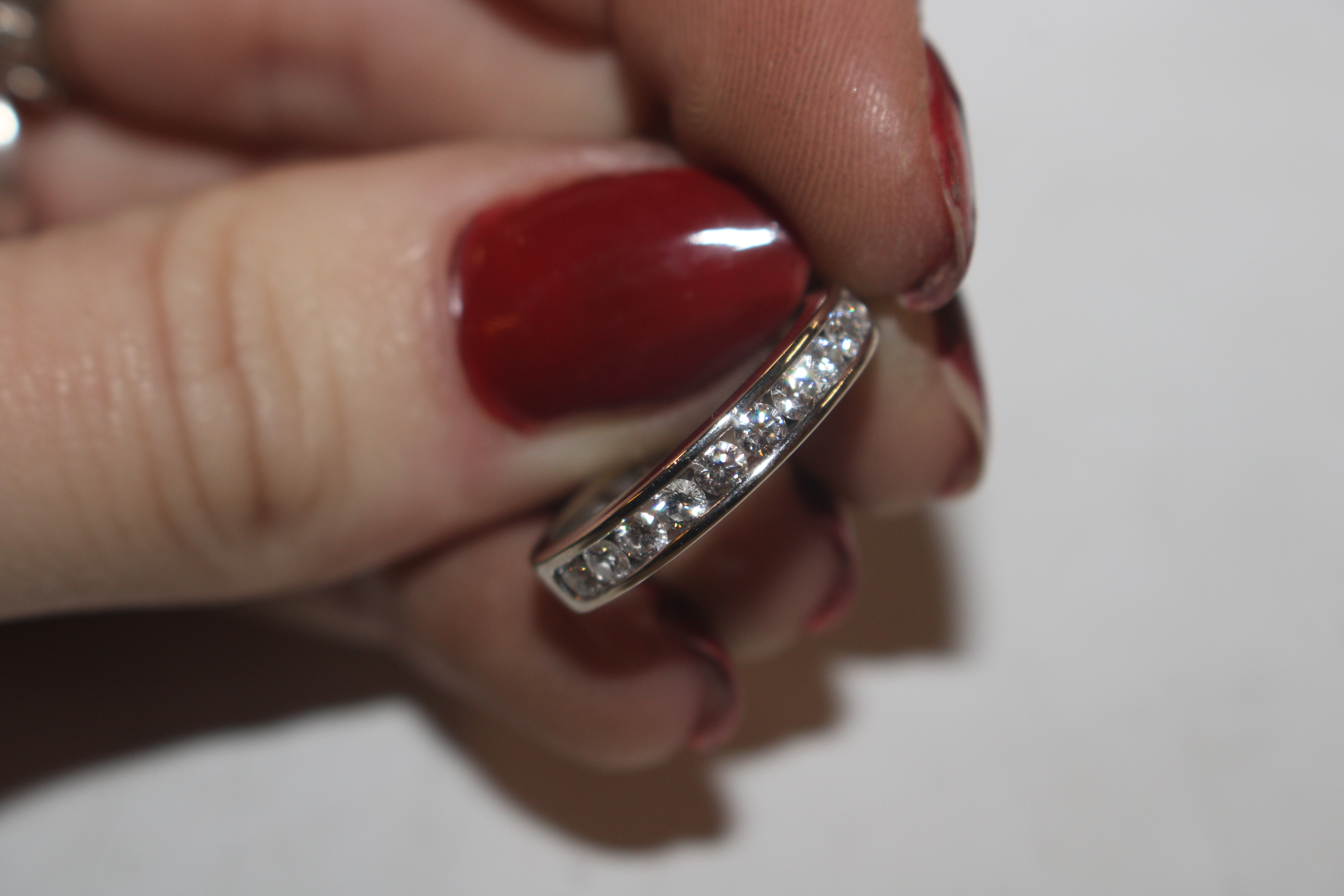 An 18ct white gold (marked rubbed) half eternity ring set with channel of ten diamonds totalling - Image 5 of 10