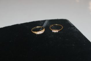 An 18ct gold ring set five graduated diamonds appr