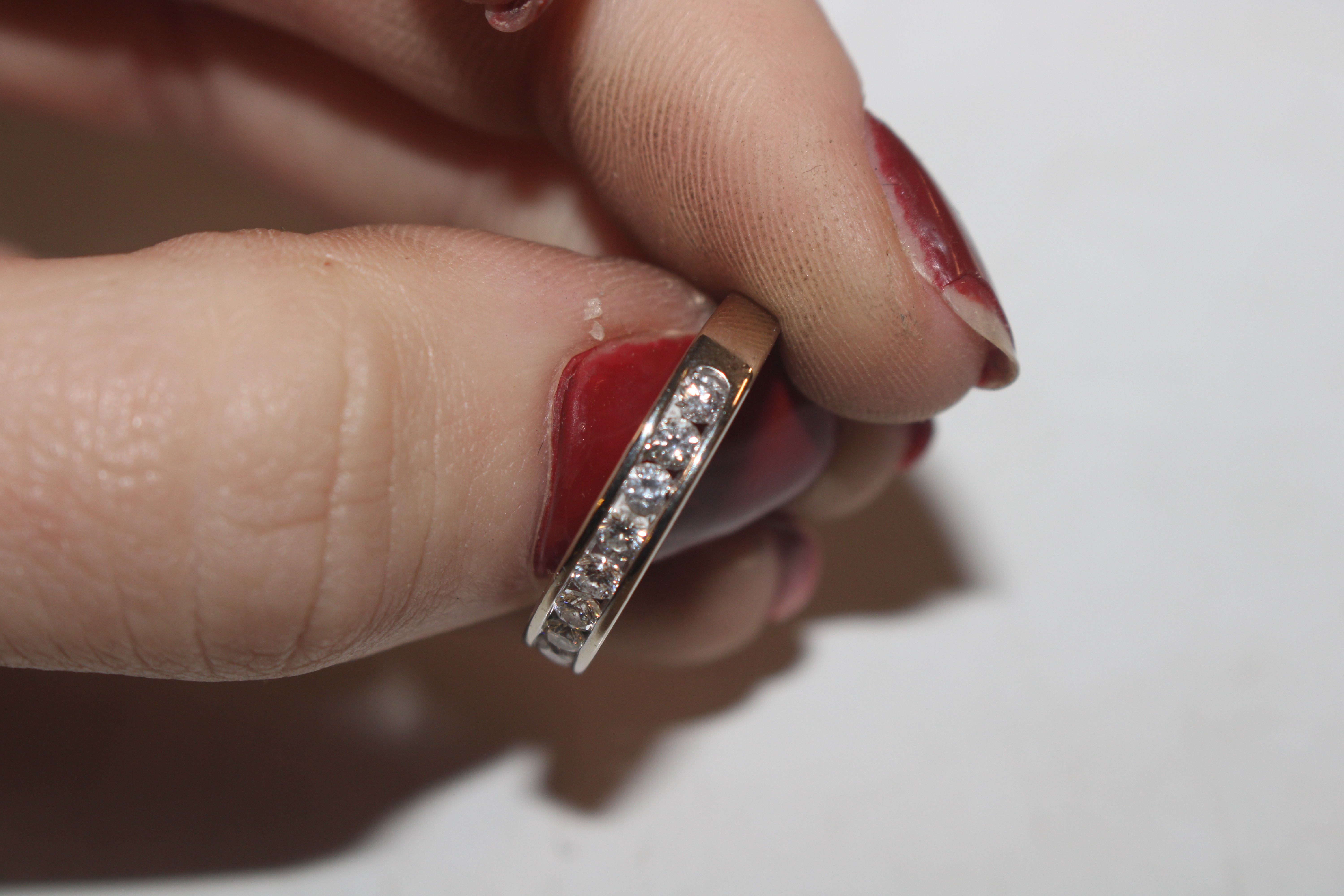An 18ct white gold (marked rubbed) half eternity ring set with channel of ten diamonds totalling - Image 6 of 10