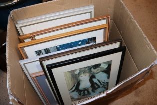 A box containing various pictures and prints