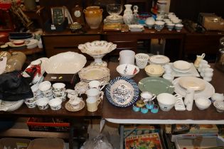 A large quantity of various dinnerware to include