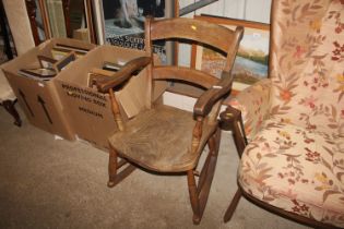 An elm seated rocking chair