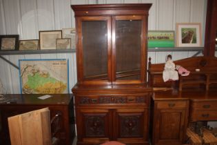 A Victorian carved walnut secretaire bookcase