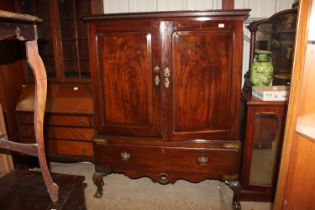 A 19th Century mahogany press cupboard raised on c