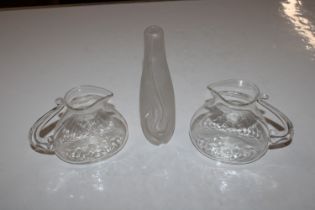 A pair of clear Art Glass Jugs and a frosted Art G