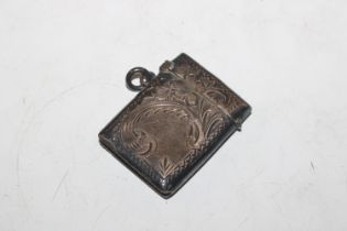 A silver vesta case