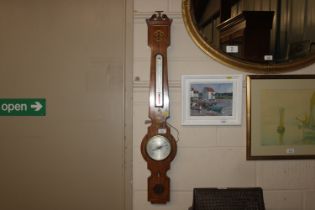 A rosewood and brass inlaid banjo barometer