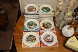 Fourteen boxed Wedgwood story plates