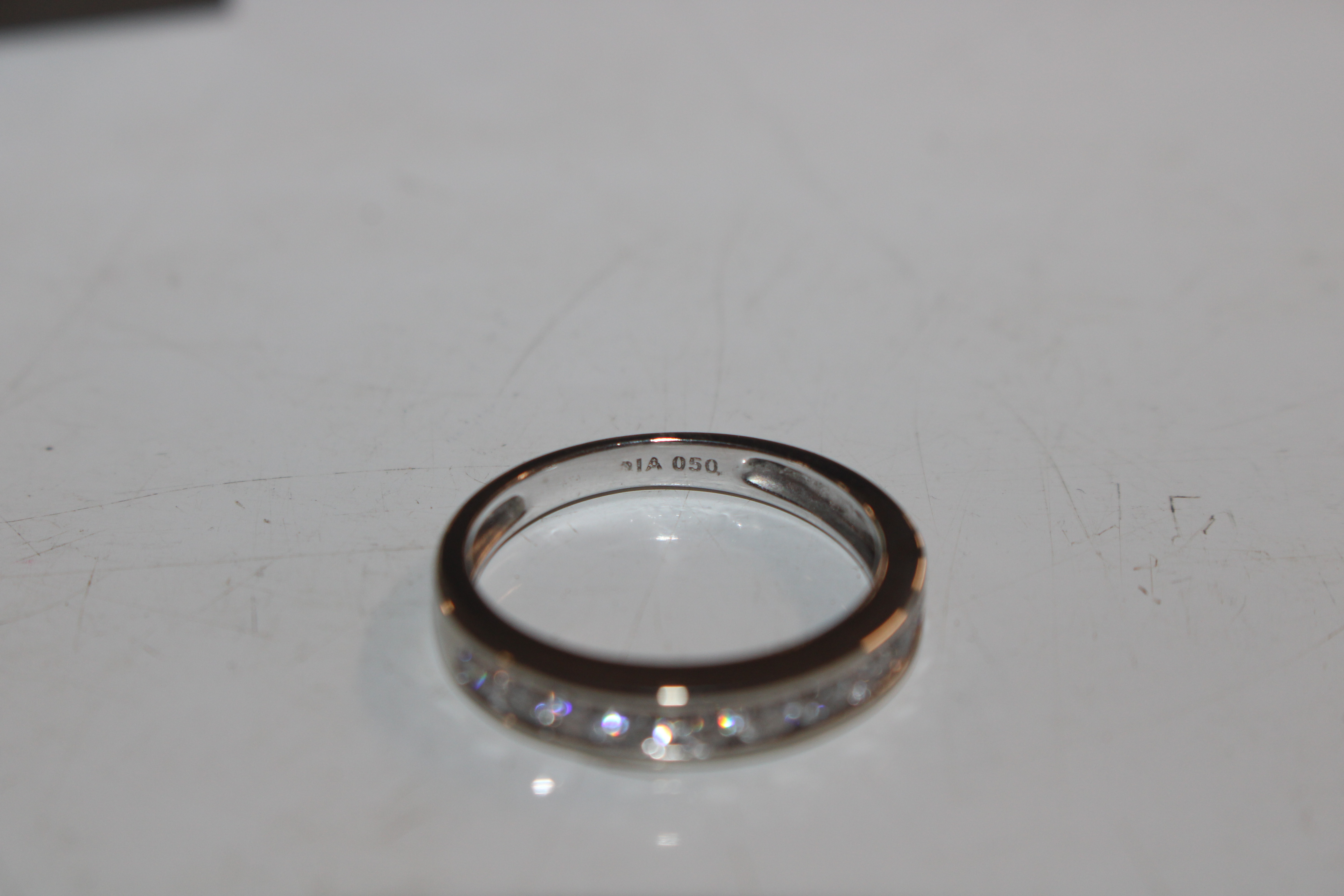 An 18ct white gold (marked rubbed) half eternity ring set with channel of ten diamonds totalling - Image 7 of 10