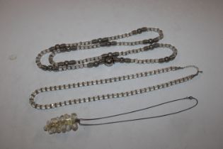 A white metal mounted necklace; white stone bead n