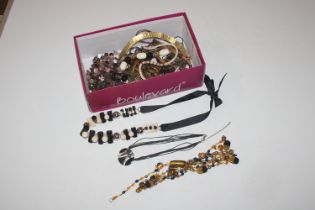 A box containing various Eastern style jewellery,