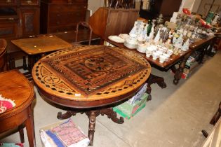 A 19th Century French marquetry oval table raised