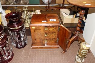 A walnut table top cabinet, interior fitted three