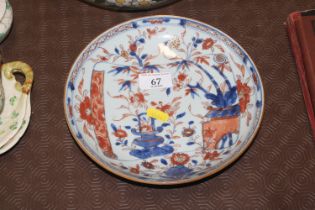 An Oriental dish decorated with flowers and bamboo