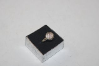 A 925 silver ring set with circular cluster of whi
