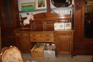 An Edwardian sideboard fitted two short over one l