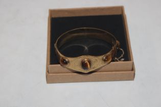 A vintage Excalibur 12ct rolled gold bangle with t